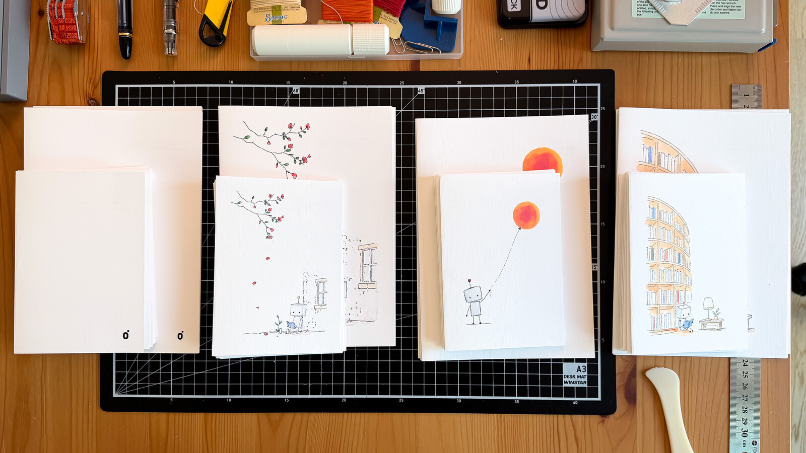 Studio Monjo notebooks and tools arranged on a worktable in Seoul.